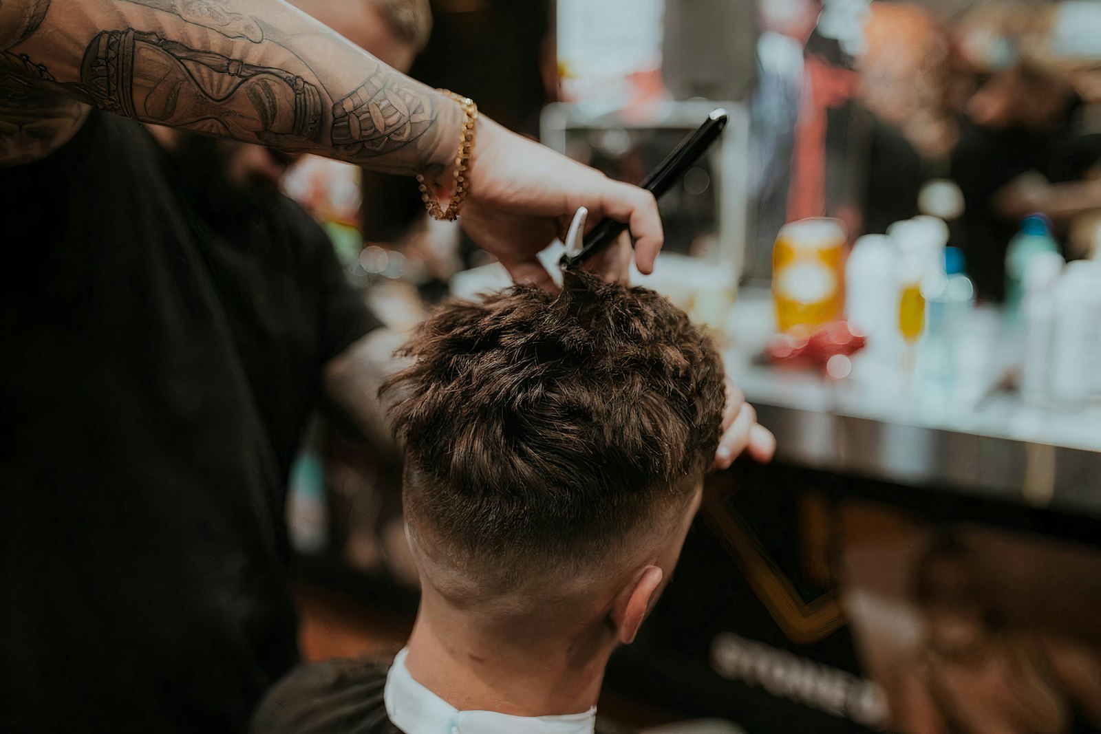 Barber shaping a client's beard